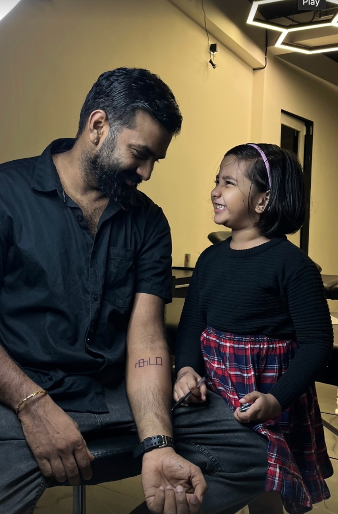 Aryan Zeus sharing a smile with his daughter